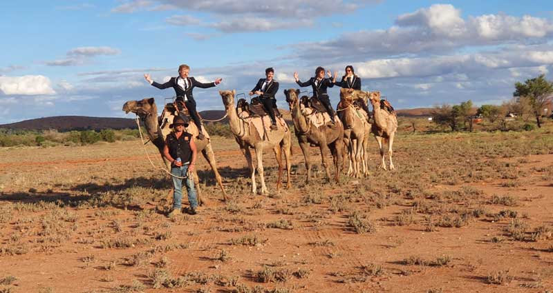 Furnace and the Fundamentals riding Camels in the Outback